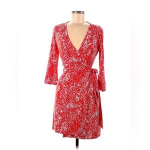 93% viscose, 7% spandex
3/4 sleeve, v-neck, wrap, bow & tie, reddish orange